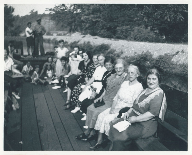 Several women sitting in a boat.