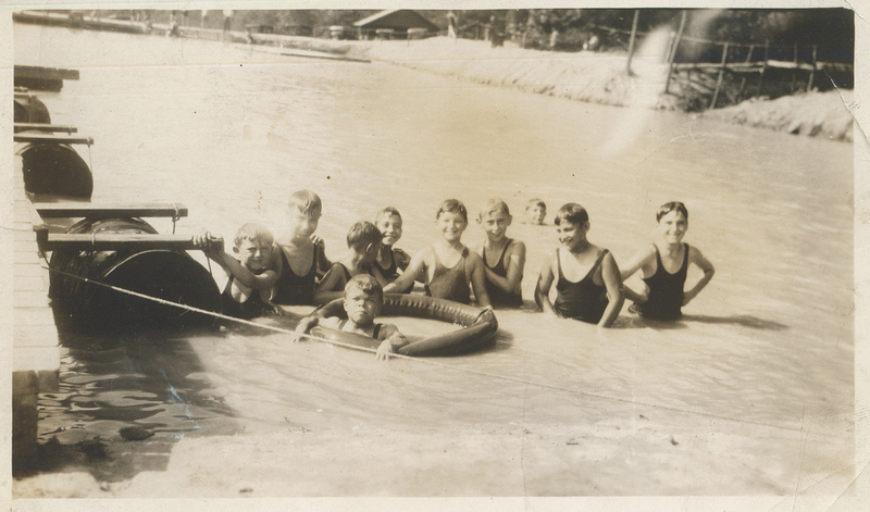 Several children standing above water.