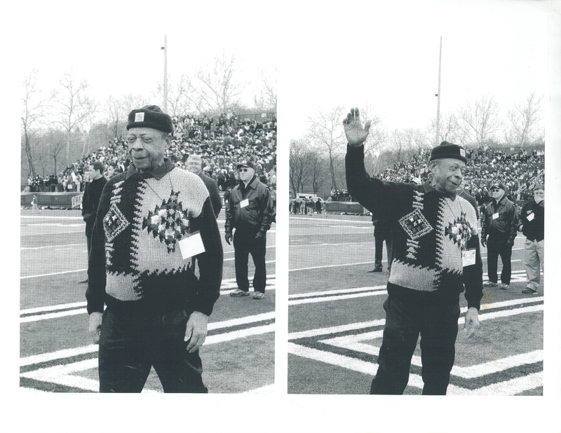 An elderly man wearing a sweater standing on a football field. In the left panel, he is walking onto the field. In the right panel, he is waving to the crowd.