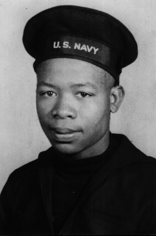 Headshot of a US Navy soldier wearing military uniform.