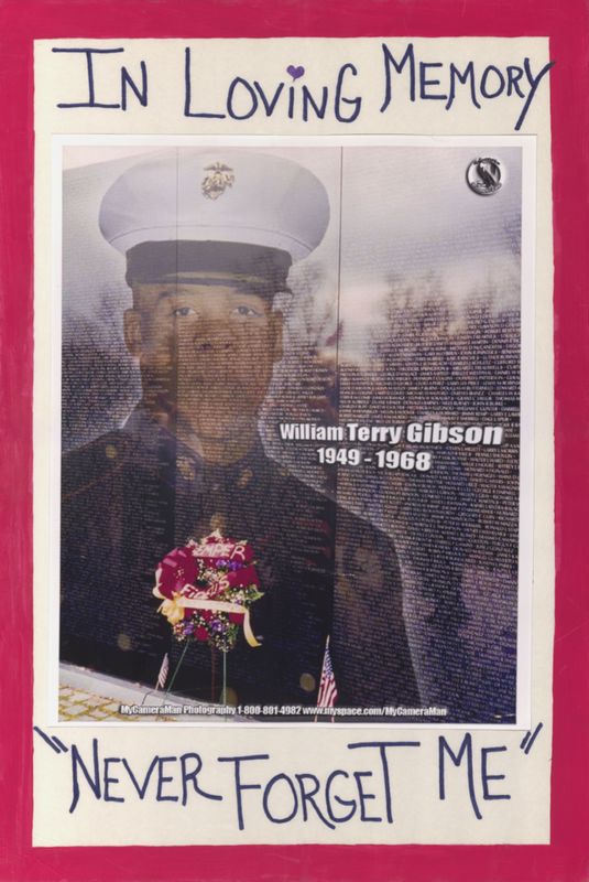 Hand-written memorial poster featuring an image of a marine superimposed on an image of the Vietnam War Memorial