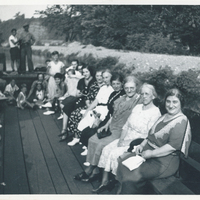 Several women sitting in a boat.